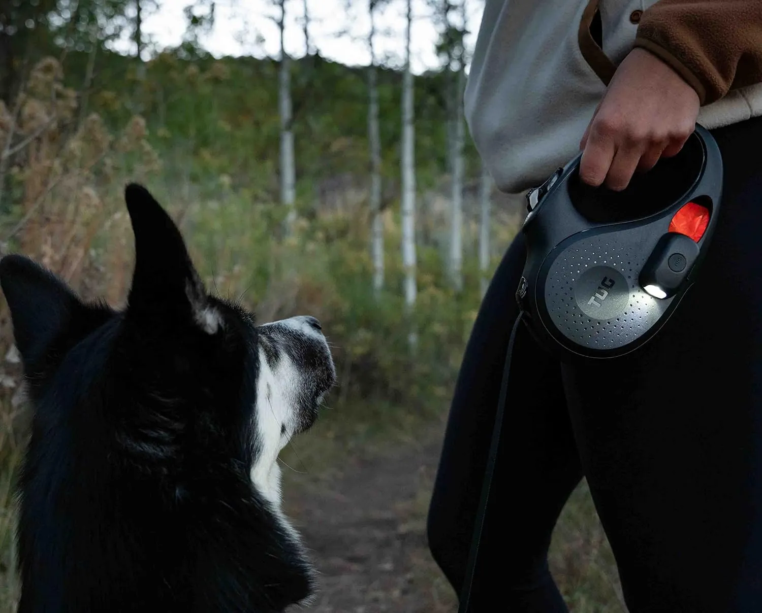 TUG Oval 360° Tangle-Free Retractable Dog Leash | Flashlight Included | Integrated Waste Bag Dispenser Pocket (Medium, Black)